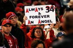 ANAHEIM, CA - APRIL 10: A fan holds up a sign in memory of Los Angeles Angels pitcher Nick Adenhart before the start of a baseball game between the Angels and the Boston Red Sox at Angel Stadium April 10, 2009 in Anaheim, California. Adenhart and two others were killed in car crash on April 9.  (Photo by Kevork Djansezian/Getty Images)