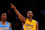 LOS ANGELES, CA - MAY 19:  Kobe Bryant #24 of the Los Angeles Lakers points as he stands with J.R. Smith #1 of the Denver Nuggets in the second half of Game One of the Western Conference Finals during the 2009 NBA Playoffs at Staples Center on May 19, 2009 in Los Angeles, California. NOTE TO USER: User expressly acknowledges and agrees that, by downloading and or using this photograph, User is consenting to the terms and conditions of the Getty Images License Agreement.  (Photo by Kevork Djansezian/Getty Images)