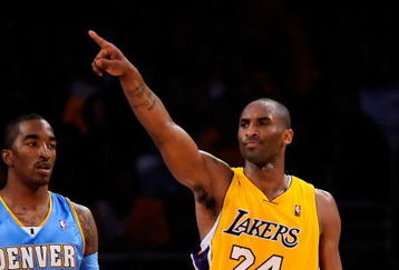 LOS ANGELES, CA - MAY 19:  Kobe Bryant #24 of the Los Angeles Lakers points as he stands with J.R. Smith #1 of the Denver Nuggets in the second half of Game One of the Western Conference Finals during the 2009 NBA Playoffs at Staples Center on May 19, 2009 in Los Angeles, California. NOTE TO USER: User expressly acknowledges and agrees that, by downloading and or using this photograph, User is consenting to the terms and conditions of the Getty Images License Agreement.  (Photo by Kevork Djansezian/Getty Images)