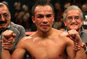 LAS VEGAS - SEPTEMBER 13:  Juan Manuel Marquez celebrates after knocking out Joel Casamayor in the 11th round during their bout at the MGM Grand Garden Arena September 13, 2008 in Las Vegas, Nevada.  (Photo by Jed Jacobsohn/Getty Images)