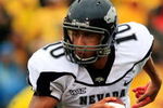 COLUMBIA, MO - SEPTEMBER 13:  Quarterback Colin Kaepernick #10 of the Nevada Wolf Pack rolls out during the first half of the game against the Missouri Tigers on September 13, 2008 at Memorial Stadium in Columbia, Missouri.  (Photo by Jamie Squire/Getty Images)