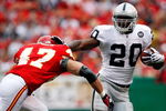 KANSAS CITY, MO - SEPTEMBER 14:  Darren McFadden #20 of the Oakland Raiders carries the ball as Jon McGraw #47 of the Kansas City Chiefs defends during the first half fo the game on September 14, 2008 at Arrowhead Stadium in Kansas City, Missouri.  (Photo by Jamie Squire/Getty Images)