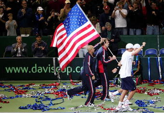 PORTLAND, OR - DECEMBER 1:  (L-R) James Blake, Andy Roddick, Bob Bryan and Mike Bryan of the U.S. celebrate after the Byran's 7-6,6-4,6-2 victory over Igor Andreev and Nikolay Davydenko of Russia to  clinch winning the Davis Cup during the second day of the Davis Cup Final at the Memorial Coliseum December 1, 2007 in Portland, Oregon.  (Photo by Jonathan Ferrey/Getty Images)
