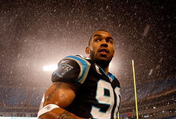 CHARLOTTE, NC - JANUARY 10:  Julius Peppers #89 of the Carolina Panthers walks off the field in the rain after being defeated by the Arizona Cardinals 33-13 in the NFC Divisional Playoff Game on January 10, 2009 at Bank of America Stadium in Charlotte, North Carolina.  (Photo by Streeter Lecka/Getty Images)