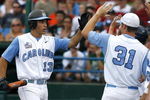 OMAHA, NE - JUNE 21:  First baseman Dustin Ackley #13 of the North Carolina Tar Heels celebrates with teammates after hitting a solo homer in the second inning to the give the Tar Heels a 1-0 lead over the Rice Owls in Game 13 of the NCAA College World Series at Rosenblatt Stadium on June 21, 2007 in Omaha, Nebraska. (Photo by Kevin C. Cox/Getty Images) 