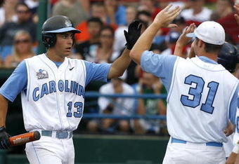 OMAHA, NE - JUNE 21:  First baseman Dustin Ackley #13 of the North Carolina Tar Heels celebrates with teammates after hitting a solo homer in the second inning to the give the Tar Heels a 1-0 lead over the Rice Owls in Game 13 of the NCAA College World Series at Rosenblatt Stadium on June 21, 2007 in Omaha, Nebraska. (Photo by Kevin C. Cox/Getty Images) 