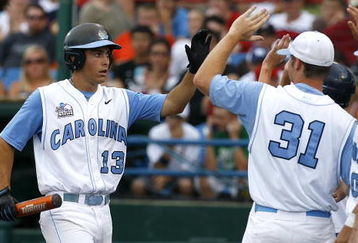 OMAHA, NE - JUNE 21:  First baseman Dustin Ackley #13 of the North Carolina Tar Heels celebrates with teammates after hitting a solo homer in the second inning to the give the Tar Heels a 1-0 lead over the Rice Owls in Game 13 of the NCAA College World Series at Rosenblatt Stadium on June 21, 2007 in Omaha, Nebraska. (Photo by Kevin C. Cox/Getty Images) 