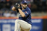FLUSHING, NY - APRIL 13:  Heath Bell #21 of the San Diego Padres pitches against the New York Mets during opening day at Citi Field on April 13, 2009 in the Flushing neighborhood of the Queens borough of New York City. This is the first regular season MLB game being played at the new venue which replaced Shea Stadium as the Mets home field.  (Photo by Nick Laham/Getty Images)