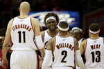 CLEVELAND - MAY 20:  LeBron James #23 reacts after a play with teammates Zydrunas Ilgauskas #11, Mo Williams #2 and Delonte West #13 of the Cleveland Cavaliers against the Orlando Magic in Game One of the Eastern Conference Finals during the 2009 Playoffs at Quicken Loans Arena on May 20, 2009 in Cleveland, Ohio. NOTE TO USER: User expressly acknowledges and agrees that, by downloading and or using this photograph, User is consenting to the terms and conditions of the Getty Images License Agreement  (Photo by Elsa/Getty Images)