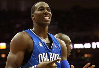 CLEVELAND - MAY 20: Dwight Howard #12 of the Orlando Magic reacts between plays against the Cleveland Cavaliers in Game One of the Eastern Conference Finals during the 2009 Playoffs at Quicken Loans Arena on May 20, 2009 in Cleveland, Ohio. NOTE TO USER: User expressly acknowledges and agrees that, by downloading and or using this photograph, User is consenting to the terms and conditions of the Getty Images License Agreement  (Photo by Elsa/Getty Images)