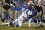FOXBORO, MA - JANUARY 18:  Linebacker Willie McGinest #55 of the New England Patriots sacks quarterback Peyton Manning #18 of the Indianapolis Colts in the AFC Championship Game on January 18, 2004 at Gillette Stadium in Foxboro, Massachusetts.  (Photo by Al Bello/Getty Images)