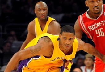 LOS ANGELES, CA - MAY 06:  Trevor Ariza #3 of the Los Angeles Lakers and Ron Artest #96 of the Houston Rockets look at the ball in the second quarter of Game Two of the Western Conference Semifinals during the 2009 NBA Playoffs at Staples Center on May 6, 2009 in Los Angeles, California. NOTE TO USER: User expressly acknowledges and agrees that, by downloading and or using this photograph, User is consenting to the terms and conditions of the Getty Images License Agreement.  (Photo by Harry How/Getty Images)