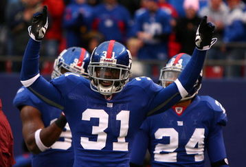 EAST RUTHERFORD, NJ - NOVEMBER 16:  Aaron Ross #31 of the New York Giants celebrates after returning an interception for a touchdown against  the Baltimore Ravens in the fourth quarter of  their game on November 16, 2008 at Giants Stadium in East Rutherford, New Jersey.  (Photo by Al Bello/Getty Images)