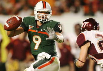 MIAMI - NOVEMBER 13:  Quarterback Robert Marve #9 of the Miami Hurricanes scrambles away from by linebacker Cody Grimm #26 of the Virginia Tech Hokies at Dolphin Stadium on November 13, 2008 in Miami, Florida.  (Photo by Doug Benc/Getty Images)