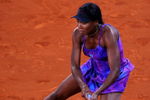 MADRID, SPAIN - MAY 12:  Venus Williams of the US slides to play a backhand to Alisa Kleybanova of Russia in her second round match during the Madrid Open tennis tournament at the Caja Magica on May 12, 2009 in Madrid, Spain.  (Photo by Jasper Juinen/Getty Images)