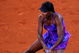 MADRID, SPAIN - MAY 12:  Venus Williams of the US slides to play a backhand to Alisa Kleybanova of Russia in her second round match during the Madrid Open tennis tournament at the Caja Magica on May 12, 2009 in Madrid, Spain.  (Photo by Jasper Juinen/Getty Images)