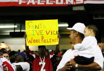 ATLANTA - DECEMBER 10:  A man holds up a sign in support of Michael Vick of the Atlanta Falcons during the game against the New Orleans Saints on December 10, 2007 at the Georgia Dome in Atlanta, Georgia.  The Saints defeated the Falcons 34-14.  (Photo by Chris Graythen/Getty Images)