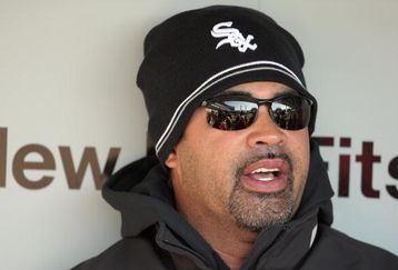 CHICAGO - APRIL 7:  Manager Ozzie Guillen #13 of the Chicago White Sox talks with the press in the dugout before the Opening Day game against the Kansas City Royals on April 7, 2009 at U.S. Cellular Field in Chicago, Illinois. (Photo by Jonathan Daniel/Getty Images) 