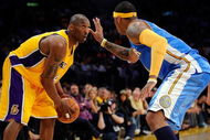 LOS ANGELES, CA - MAY 21:  Kobe Bryant #24 of the Los Angeles Lakers looks to drive against Carmelo Anthony #15 of the Denver Nuggets in the fourth quarter of Game Two of the Western Conference Finals during the 2009 NBA Playoffs at Staples Center on May 21, 2009 in Los Angeles, California. NOTE TO USER: User expressly acknowledges and agrees that, by downloading and or using this photograph, User is consenting to the terms and conditions of the Getty Images License Agreement.  (Photo by Kevork Djansezian/Getty Images)