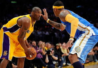 LOS ANGELES, CA - MAY 21:  Kobe Bryant #24 of the Los Angeles Lakers looks to drive against Carmelo Anthony #15 of the Denver Nuggets in the fourth quarter of Game Two of the Western Conference Finals during the 2009 NBA Playoffs at Staples Center on May 21, 2009 in Los Angeles, California. NOTE TO USER: User expressly acknowledges and agrees that, by downloading and or using this photograph, User is consenting to the terms and conditions of the Getty Images License Agreement.  (Photo by Kevork Djansezian/Getty Images)