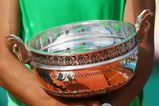 PARIS - JUNE 08:  Rafael Nadal of Spain holds the trophy following his victory during the Men's Singles Final match against Roger Federer of Switzerland on day fifteen of the French Open at Roland Garros on June 8, 2008 in Paris, France.  (Photo by Julian Finney/Getty Images)