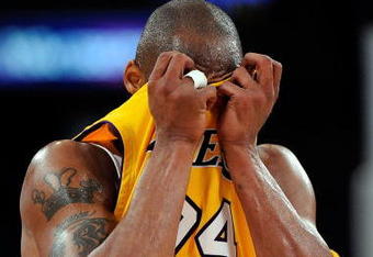 LOS ANGELES, CA - MAY 21:  Kobe Bryant #24 of the Los Angeles Lakers wipes his face in the second quarter against the Denver Nuggets in Game Two of the Western Conference Finals during the 2009 NBA Playoffs at Staples Center on May 21, 2009 in Los Angeles, California. NOTE TO USER: User expressly acknowledges and agrees that, by downloading and or using this photograph, User is consenting to the terms and conditions of the Getty Images License Agreement.  (Photo by Kevork Djansezian/Getty Images)