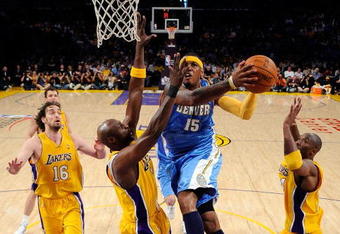 LOS ANGELES, CA - MAY 21:  Carmelo Anthony #15 of the Denver Nuggets goes for a shot between Lamar Odom #7 and Kobe Bryant #24 of the Los Angeles Lakers in the first half in Game Two of the Western Conference Finals during the 2009 NBA Playoffs at Staples Center on May 21, 2009 in Los Angeles, California. NOTE TO USER: User expressly acknowledges and agrees that, by downloading and or using this photograph, User is consenting to the terms and conditions of the Getty Images License Agreement.  (Photo by Kevork Djansezian/Getty Images)