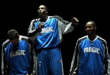 ORLANDO, FL - OCTOBER 29:  Dwight Howard #12 of the Orlando Magic dances as he is introduced along with teammates Hedo Turkoglu #15  (L) and Rashard Lewis #9 before taking on the Atlanta Hawks at Amway Arena on October 29, 2008 in Orlando, Florida. The Hawks defeated the Magic 99-85. NOTE TO USER: User expressly acknowledges and agrees that, by downloading and/or using this Photograph, user is consenting to the terms and conditions of the Getty Images License Agreement.  (Photo by Doug Benc/Getty Images)