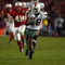 3 Jan 2002:  Clinton Portis #28 of Miami carries the football against the Nebraska defense during the Rose Bowl National Championship game at the Rose Bowl in Pasadena, California.  Miami won the game 37-14, winning the BCS and the National Championship title. DIGITAL IMAGE. Mandatory Credit: Harry How/Getty Images