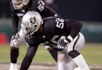 OAKLAND, CA - DECEMBER 23: Derrick Burgess #56 of the Oakland Raiders gets ready to move at the snap during the game against the Kansas City Chiefs at McAfee Coliseum on December 23, 2006 in Oakland, California. (Photo by Jed Jacobsohn/Getty Images)