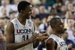 GLENDALE, AZ - MARCH 26:  Center Hasheem Thabeet #34 of the Connenticut Huskies celebrates with guard Craig Austrie #24 after defeating the Purdue Boilermakers 72-60 in the Sweet 16 of the NCAA Division I Men's Basketball Tournament at the University of Phoenix Stadium on March 26, 2009 in Glendale, Arizona.  (Photo by Ronald Martinez/Getty Images)
