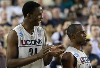GLENDALE, AZ - MARCH 26:  Center Hasheem Thabeet #34 of the Connenticut Huskies celebrates with guard Craig Austrie #24 after defeating the Purdue Boilermakers 72-60 in the Sweet 16 of the NCAA Division I Men's Basketball Tournament at the University of Phoenix Stadium on March 26, 2009 in Glendale, Arizona.  (Photo by Ronald Martinez/Getty Images)