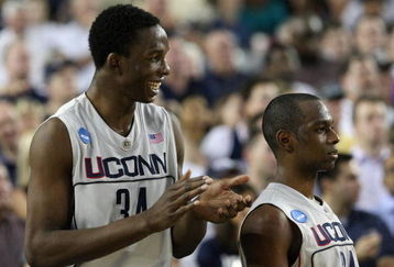 GLENDALE, AZ - MARCH 26:  Center Hasheem Thabeet #34 of the Connenticut Huskies celebrates with guard Craig Austrie #24 after defeating the Purdue Boilermakers 72-60 in the Sweet 16 of the NCAA Division I Men's Basketball Tournament at the University of Phoenix Stadium on March 26, 2009 in Glendale, Arizona.  (Photo by Ronald Martinez/Getty Images)