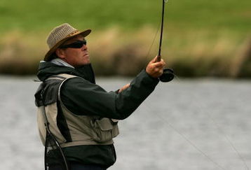 CHRISTCHURCH, NEW ZEALAND - FEBRUARY 24: An angler fishes for trout in the lake during Day 3 of the New Zealand PGA Championship at Clearwater February 24, 2007 in Christchurch, New Zealand.  (Photo by Phil Walter/Getty Images)