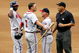 NEW YORK - SEPTEMBER 06:  First base coach Glenn Hubbard of the Atlanta Braves gets between Jeff Francoeur #7 and umpire Kerwin Danley as Francoeur argues after being called out on fan interference against the New York Mets as Edgar Renteria #11 looks on on September 6, 2006 during the second game of their doubleheader at Shea Stadium in the Flushing neighborhood of the Queens borough of New York City.   (Photo by Jim McIsaac/Getty Images)