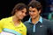 MADRID, SPAIN - MAY 17:  Roger Federer of Switzerland (R) and Rafael Nadal of Spain share a moment during the prize giving ceremony after the mens final during the Madrid Open tennis tournament at the Caja Magica on May 17, 2009 in Madrid, Spain.  (Photo by Clive Brunskill/Getty Images)