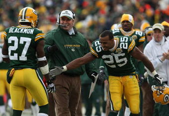 GREEN BAY, WI - DECEMBER 09: Head coach Mike McCarthy and Ryan Grant #25 of the Green Bay Packers congratulate Will Blackmon #27 after a successful punt return to a touchdown against the Oakland Raiders on December 9, 2007 at Lambeau Field in Green Bay, Wisconsin. (Photo by Jonathan Daniel/Getty Images)