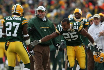 GREEN BAY, WI - DECEMBER 09: Head coach Mike McCarthy and Ryan Grant #25 of the Green Bay Packers congratulate Will Blackmon #27 after a successful punt return to a touchdown against the Oakland Raiders on December 9, 2007 at Lambeau Field in Green Bay, Wisconsin. (Photo by Jonathan Daniel/Getty Images)