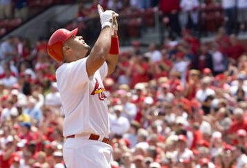 ST. LOUIS, MO - APRIL 23: Albert Pujols #5 of the St. Louis Cardinals celebrates his first home run of the game against the New York Mets on April 23, 2009 at Busch Stadium in St. Louis, Missouri. The Cardinals beat the Mets 12-8.  (Photo by Dilip Vishwanat/Getty Images)