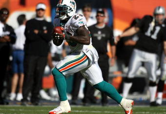 MIAMI - NOVEMBER 16:  Running back Ronnie Brown #23 of the Miami Dolphins runs against the Oakland Raiders in the second quarter on November 16, 2008 at Dolphin Stadium in Miami, Florida. The Dolphins defeated the Raiders 17-15.  (Photo by Marc Serota/Getty Images)