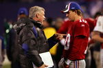 EAST RUTHERFORD, NJ - DECEMBER 03:  Eli Manning #10 of the New York Giants talks with Quarterbacks coach Kevin Gilbride before a game against the Dallas Cowboys at Giants Stadium on December 3, 2006 in East Rutherford, New Jersey.  (Photo by Chris McGrath/Getty Images)
