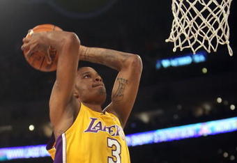 LOS ANGELES, CA - MAY 12:  Trevor Ariza #3 of the Los Angeles Lakers goes up for a dunk in the first quarter against the Houston Rockets in Game Five of the Western Conference Semifinals during the 2009 NBA Playoffs at Staples Center on May 12, 2009 in Los Angeles, California. NOTE TO USER: User expressly acknowledges and agrees that, by downloading and or using this photograph, User is consenting to the terms and conditions of the Getty Images License Agreement.  (Photo by Stephen Dunn/Getty Images)