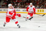 DENVER - MARCH 04:  Brian Rafalski #28 of the Detroit Red Wings takes a shot against the Colorado Avalanche during NHL action at the Pepsi Center on March 4, 2009 in Denver, Colorado. The Red Wings defeated the Avalanche 3-2.  (Photo by Doug Pensinger/Getty Images)