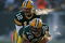 GREEN BAY, WI - DECEMBER 28: Aaron Rodgers #12 of the Green Bay Packers awaits the snap from George Foster #72 during a game against the Detroit Lions on December 28, 2008 at Lambeau Field in Green Bay, Wisconsin. The Packers defeated the Lions 31-21.  (Photo by Jonathan Daniel/Getty Images)