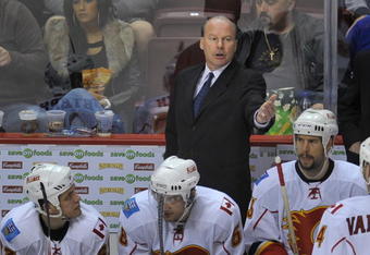 VANCOUVER, CANADA - APRIL 7: Calgary Flames Head Coach Mike Keenan instructs a player during their game against the Vancouver Canucks at General Motors Place April 7, 2009 in Vancouver, Canada.   (Photo by Nick Didlick/Getty Images)