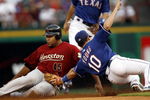 ARLINGTON, TX - JUNE 24:  Carlos Lee #45 of the Houston Astros is tagged out by Michael Young #10 of the Texas Rangers at the Rangers Ballpark June 24, 2007 in Arlington, Texas.  (Photo by Layne Murdoch/Getty Images)