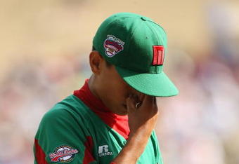 WILLIAMSPORT, PA - AUGUST 24:  Starting pitcher Sergio Rodriguez #15 of Mexico reacts after giving up a home run against the United States during the Little League World Series Championship game at Lamade Stadium on August 24, 2008 in Williamsport, Pennsylvania. The United States defeated Mexico 12-3.  (Photo by Doug Benc/Getty Images)
