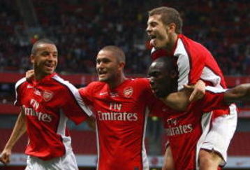 LONDON, ENGLAND - MAY 22:  Gilles Sunu of Arsenal celebrates with team mates after scoring the first goal during the FA Youth Cup Final 1st Leg match between Arsenal and Liverpool at The Emirates Stadium on May 22, 2009 in London, England.  (Photo by Julian Finney/Getty Images)