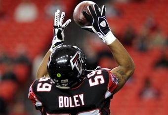 ATLANTA - DECEMBER 14: Linebacker Michael Boley #59 of the Atlanta Falcons grabs a warm-up pass before play against the Tampa Bay Buccaneers  at the Georgia Dome on December 14, 2008 in Atlanta, Georgia.  (Photo by Al Messerschmidt/Getty Images) 