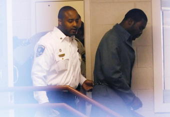 Sussex, VA - NOVEMBER 25:  Suspended Atlanta Falcons quarterback Michael Vick (R) leaves Surry County Circuit Court after entering a guilty plea on two felony counts connected to dog fighting on November 25, 2008 in Sussex, Virginia. Under a plea agreement, Vick, who is currently serving a term in prison for federal dog fighting charges, will serve one-year of probation for the state charges. He is scheduled to be released on July of 2009.  (Photo by Geoff Burke/Getty Images)